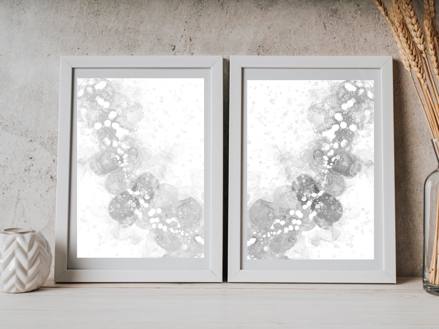 Abstract wall art, embodying a silver wishbone type image, calming, grey and silver, displayed in frames.
